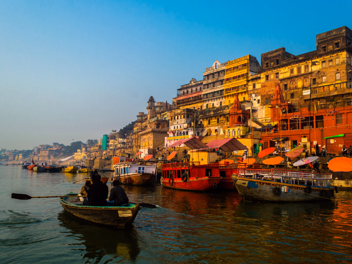 A flower-filled lane leading toward the ghats of Varanasi.