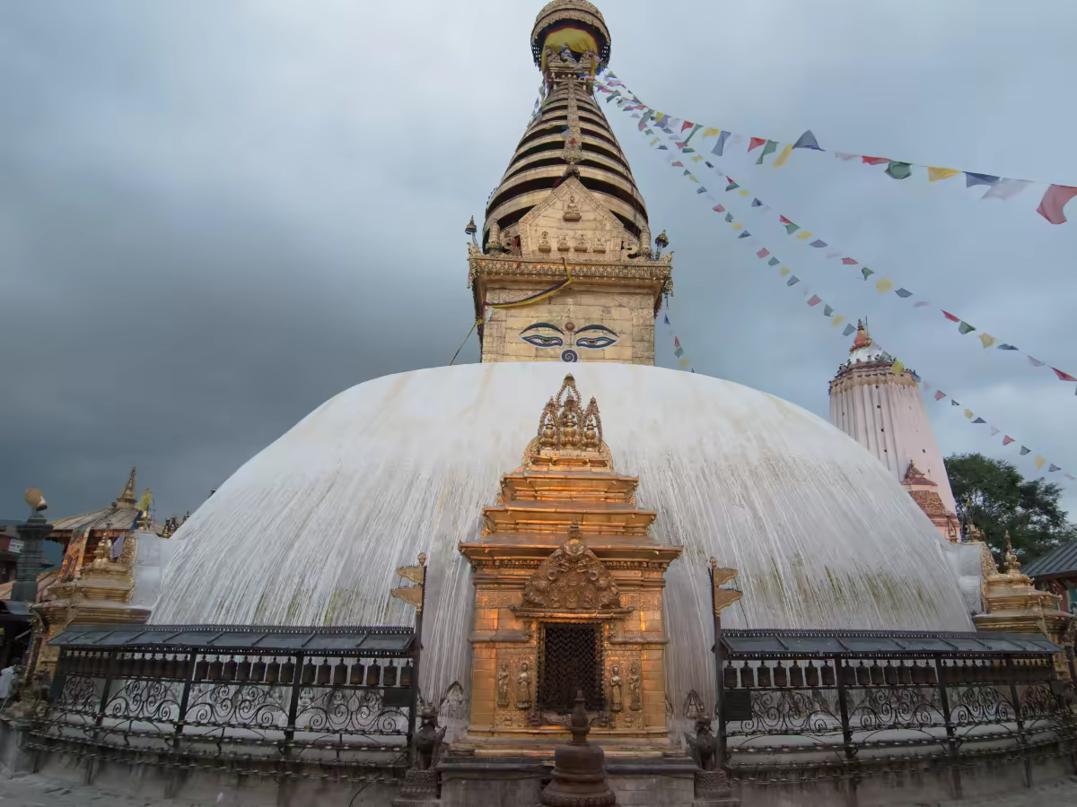 Swayambhunath Stupa above Kathmandu Valley with prayer flags.