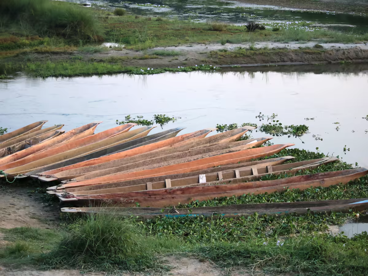 A canoe moving along the Rapti River in Chitwan National Park.