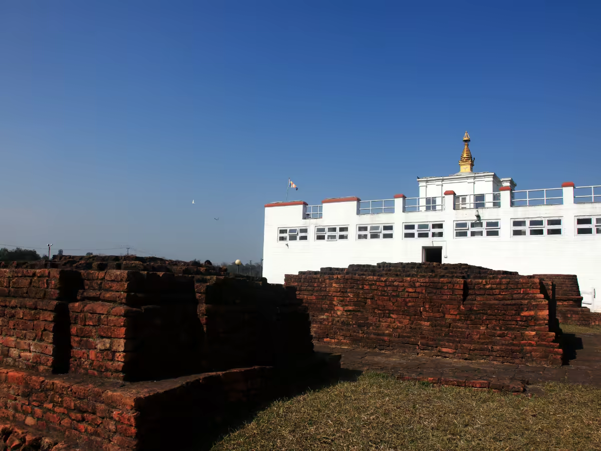 Maya Devi Temple and the Ashoka Pillar in Lumbini's sacred garden.