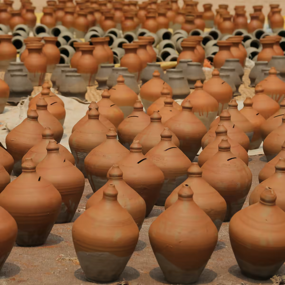 A potter working in Bhaktapur's traditional brick courtyard.
