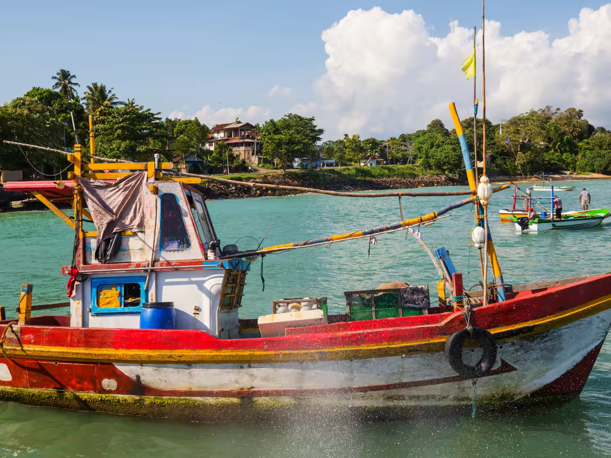 A fishing boat on a quiet beach on Sri Lanka's east coast.