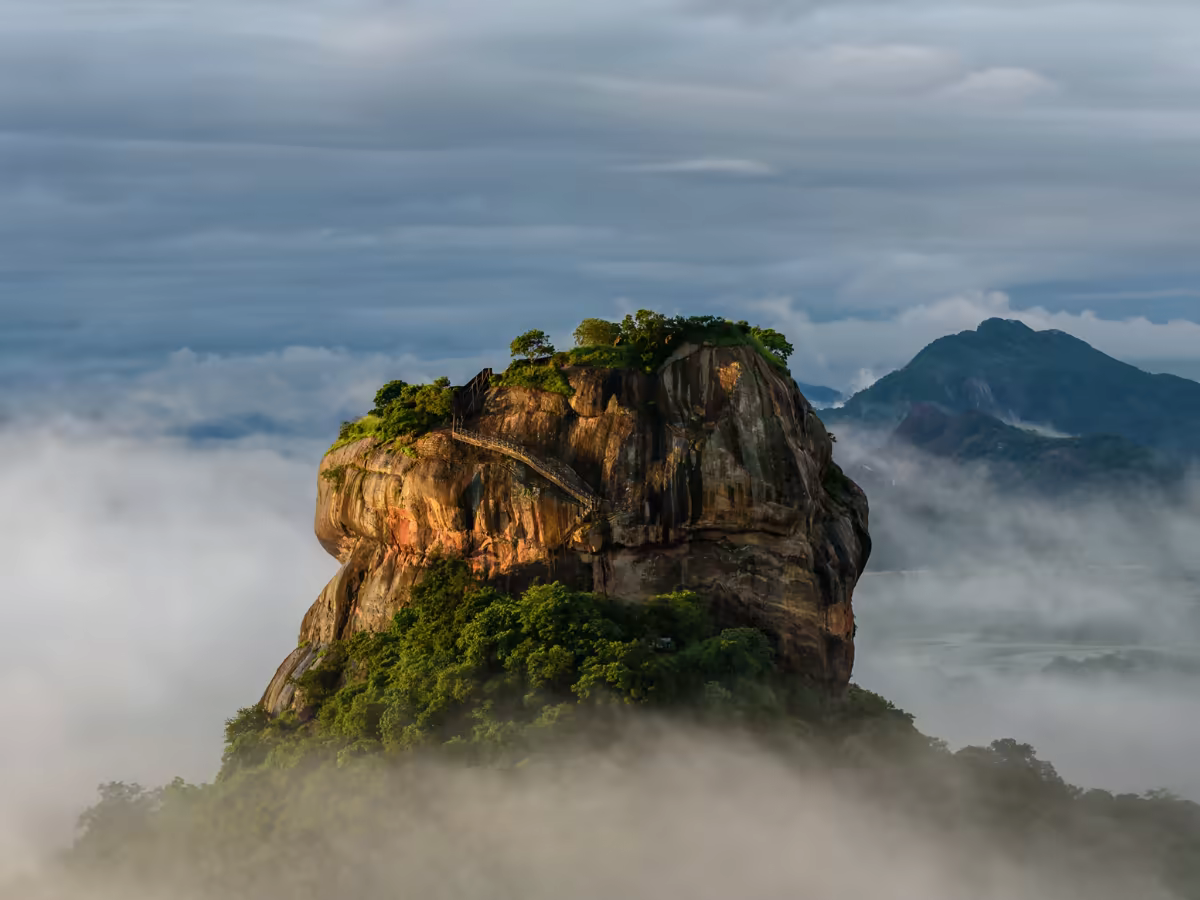 Sigiriya Lion Rock rising above Sri Lanka's dry-zone forest.