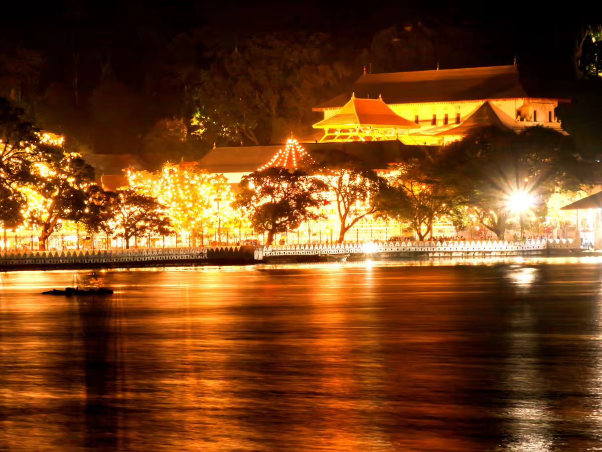 Kandy Lake and the Temple of the Tooth roofline at evening.